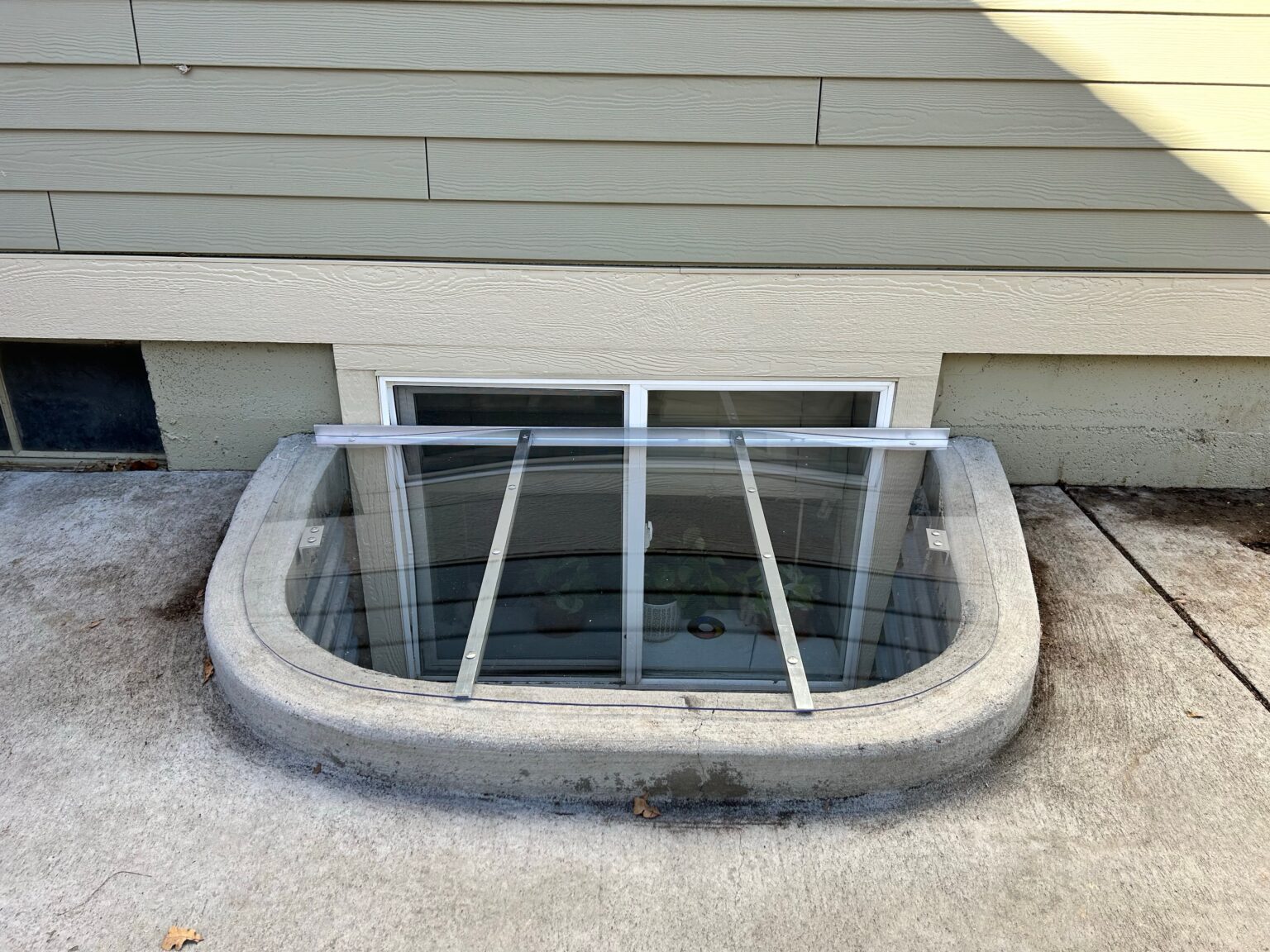 Custom window well cover installation in Fort Collins, CO