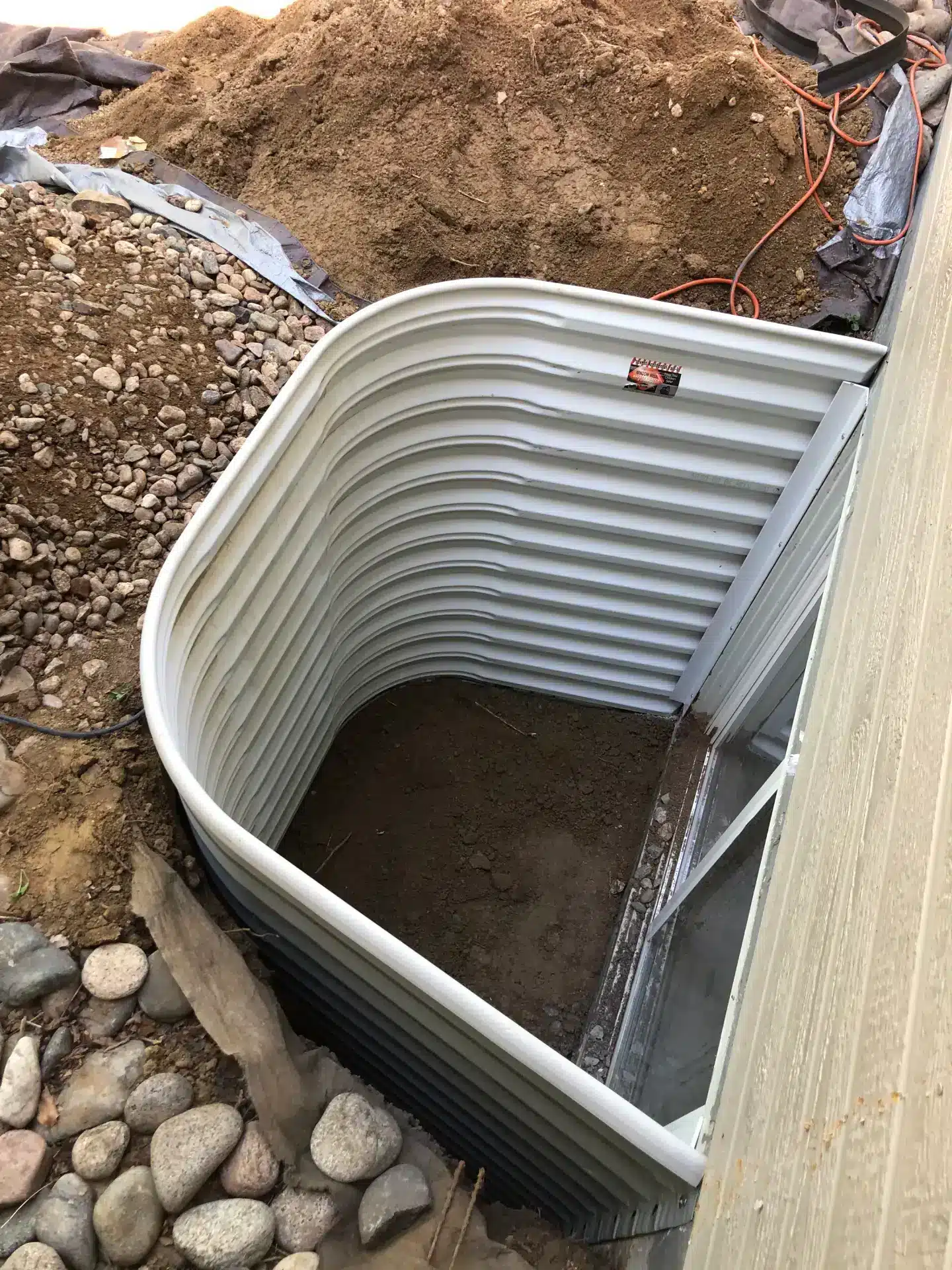 Failing window well liner inspection in Fort Collins home